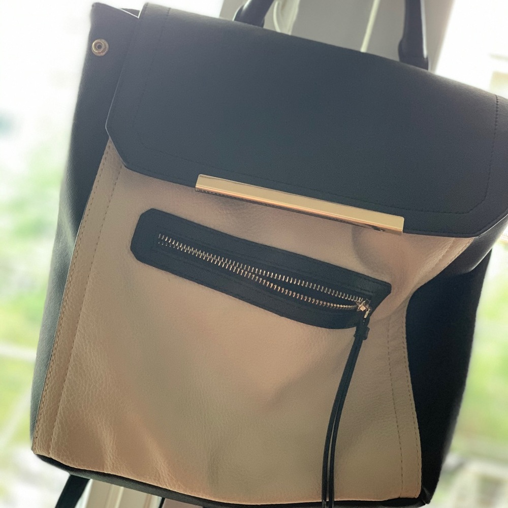 TAN AND BACK PURSE w/ backpack straps and a handle